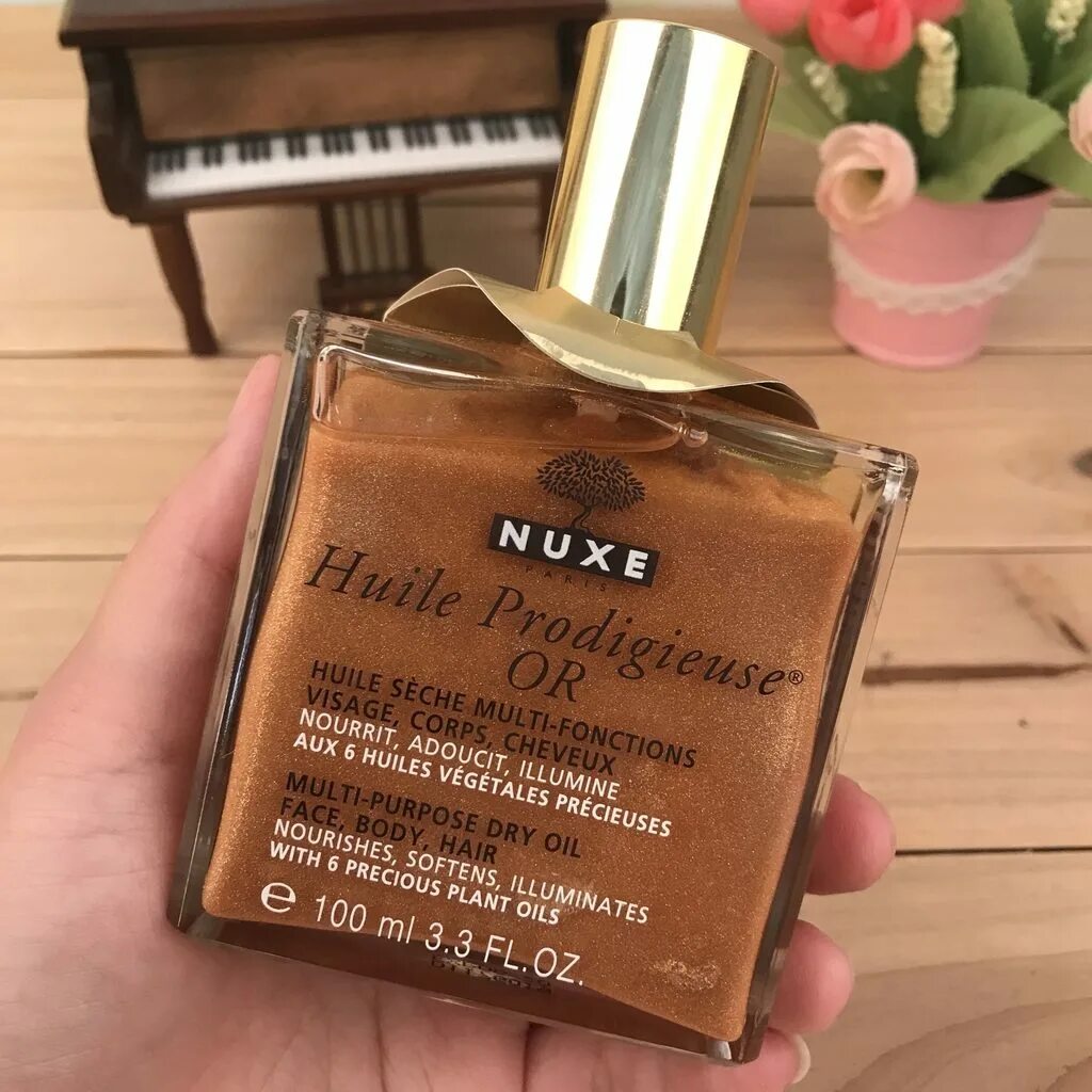 Сухое масло nuxe huile prodigieuse. Nuxe масло золотое 50ml. Масло шиммер для тела nuxe. Сухое масло с шиммером. Nuxe сухое масло.