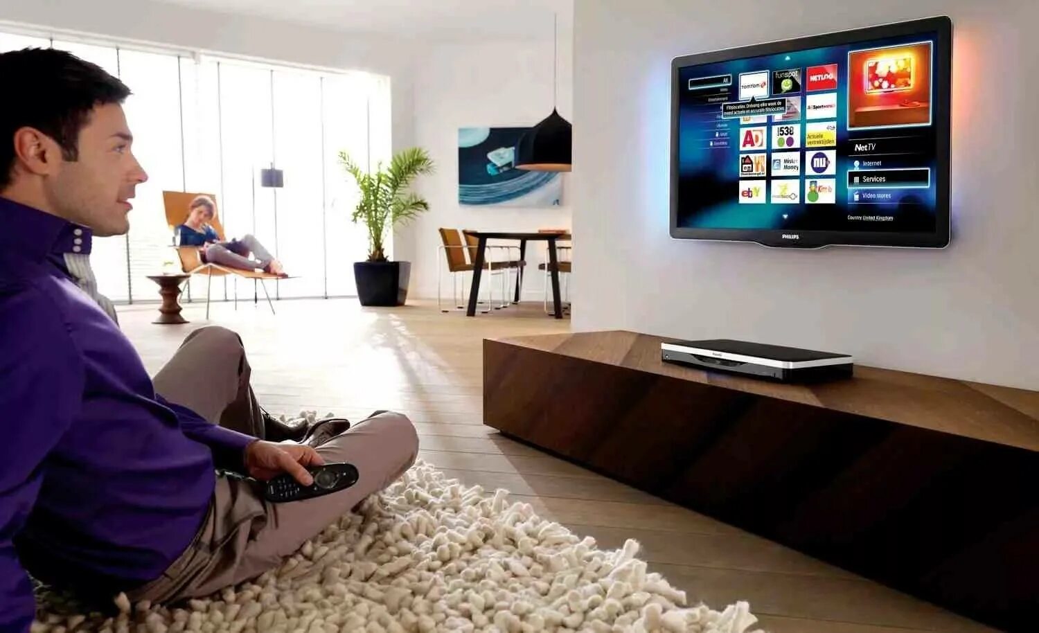 Tv in our life. Телевизор. Комната с телевизором. Смарт телевизор в комнате. Современное Телевидение.