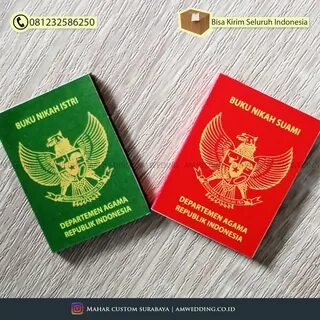 two red and green passports sitting next to each other on top of a wooden t...