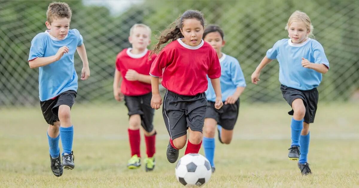 Look is playing football. They are playing football. Boy is playing football. Игра футбол. Влияние футбола на человека.