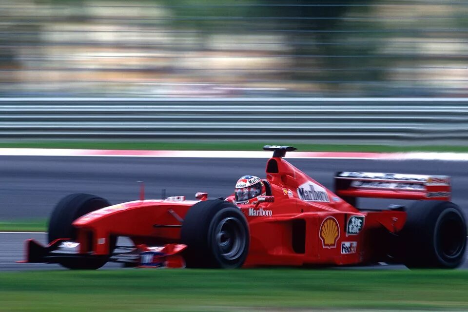 Ferrari f1 2000. Михаэль Шумахер Феррари 2000. Михаэль Шумахер Феррари. Феррари Шумахер 1999.