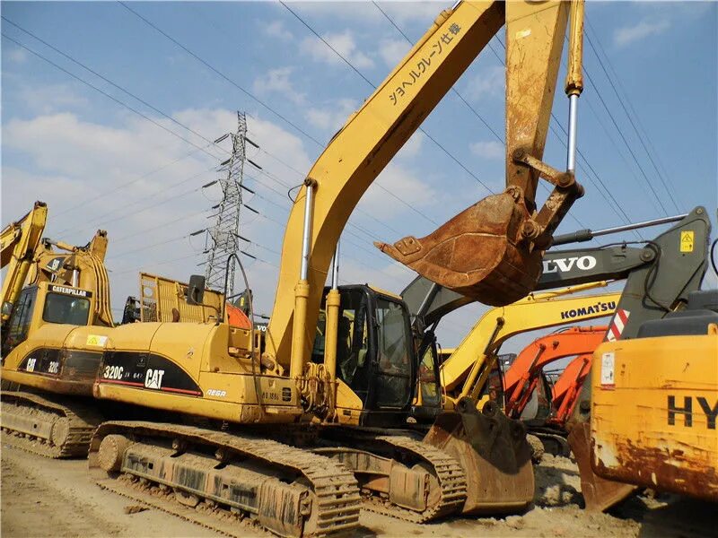 Экскаватор 1 час. Cat 320c. японский экскаватор катерпиллер. экскаватор 320. кат 320 экскаватор с подъемной кабиной.