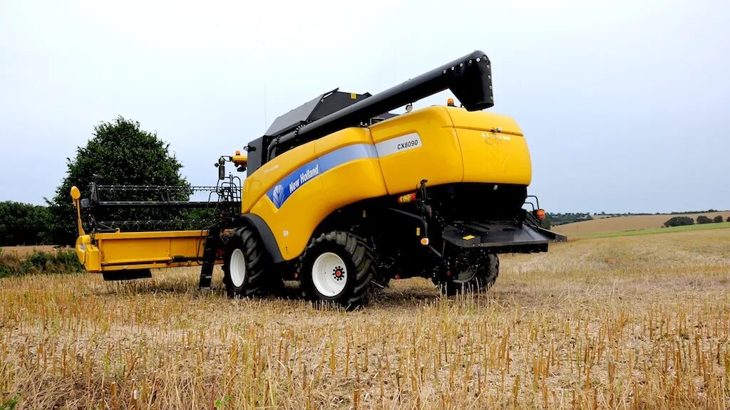 New holland cx 6. Нев холланд комбайн. Комбайн new holland cx. New holland cx8. Комбайн нью холланд 6070.