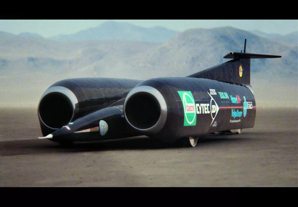 Траст SSC. Энди Грин на Thrust SSC. Реактивная машина Thrust SSC. Thrust SSC 1997. Рекордсмены скорости в мире машин