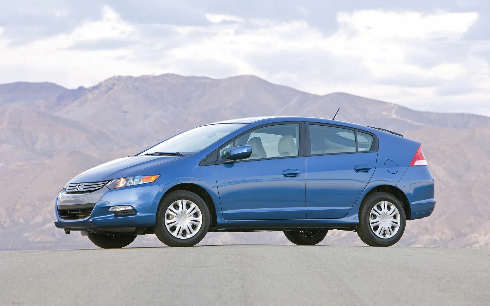 Хонда гибрид характеристики. Honda insight 2010. honda insight ii 2010. honda insight ex 2010. honda insight гибрид 2010.