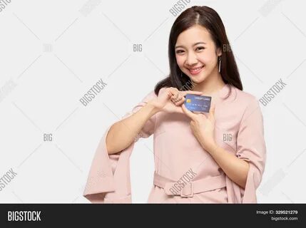 Download high-quality Young beautiful Asian woman smiling, showing, images