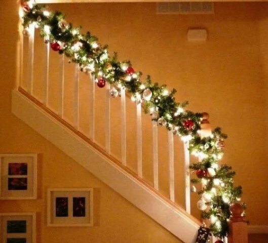 Christmas staircase swags Christmas stairs decorations, Easy christmas decoratio