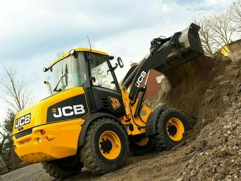 Погрузчик JCB 406. Фронтальный погрузчик JSB. JCB 406 фронтальный. Трактор JCB фронтальный погрузчик.