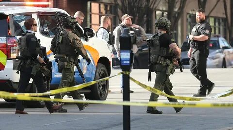 Police deploy at the scene of a mass shooting in downtown Louisville, Kentu...