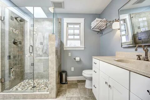 Tiled walk-in shower with bathroom walls and floor tiling matching.