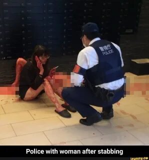Police with woman after stabbing - Police with woman after stabbing.