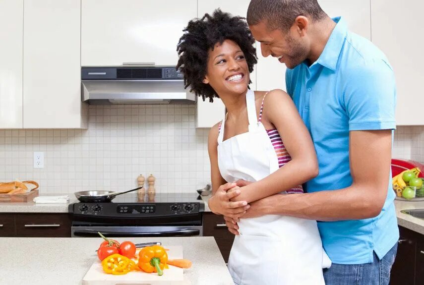 Love couple Cooking together. Couple Cooking. Real thing together. Latina Happy couple.