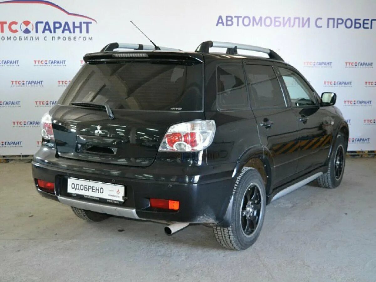 Продажа mitsubishi с пробегом. Митсубиси Аутлендер 1 поколения. Митсубиси Аутлендер 1 поколения черный.