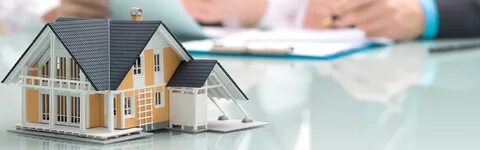 Happy homeowners signing loan documents