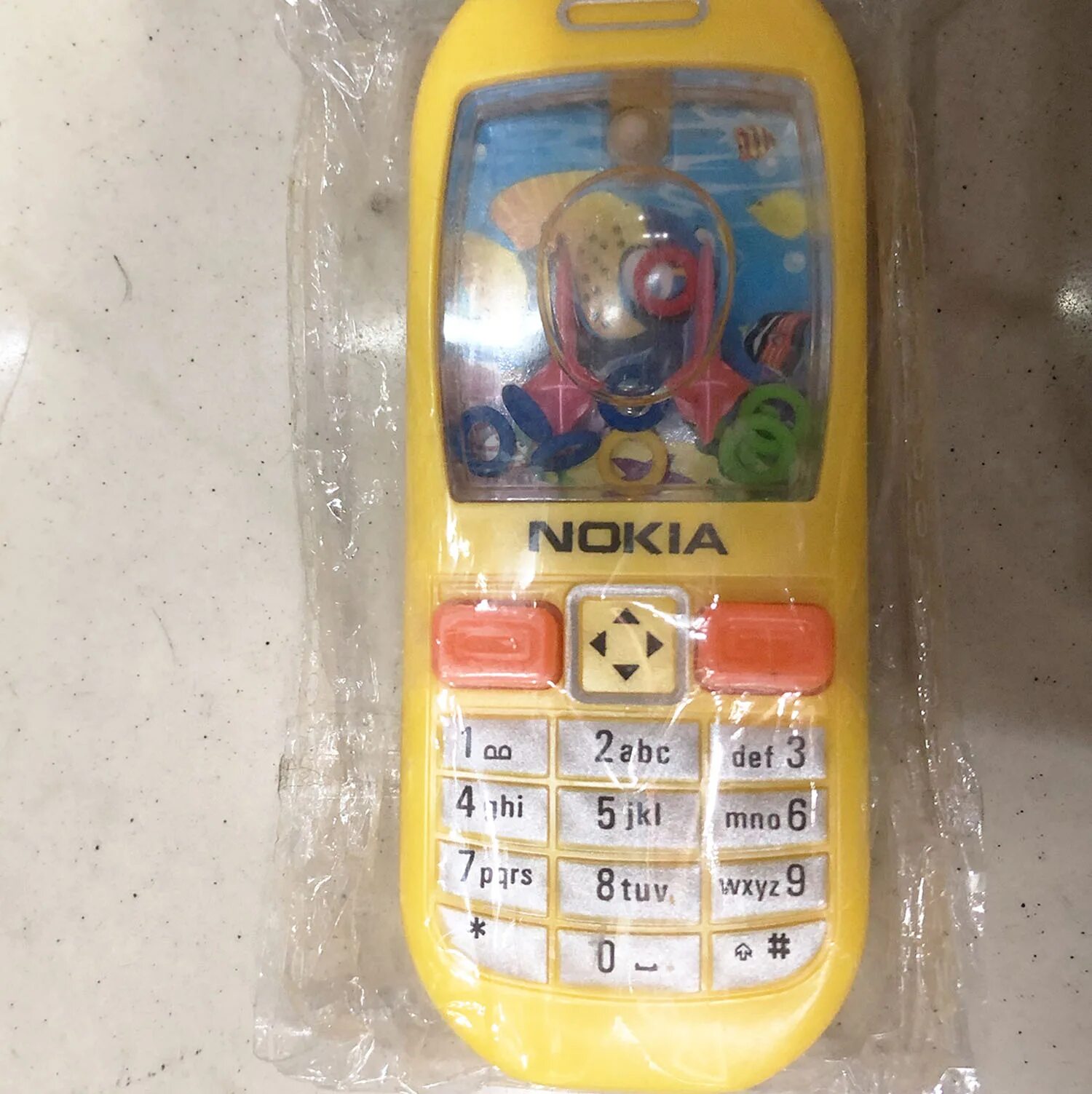 Пластиковый телефон купить. Игрушечный телефон Nokia. Игрушка "телефон". Игрушечный телефон с водой. Игрушечный айфон.