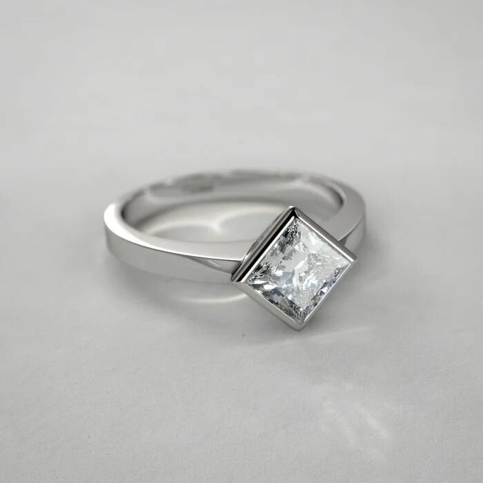 Кольцо с прямоугольным бриллиантом. Кольцо из белого золота с квадратным камнем. Кольцо картье огранка принцесса. Прямоугольное кольцо с камушками. Помолвочное кольцо смарагд.
