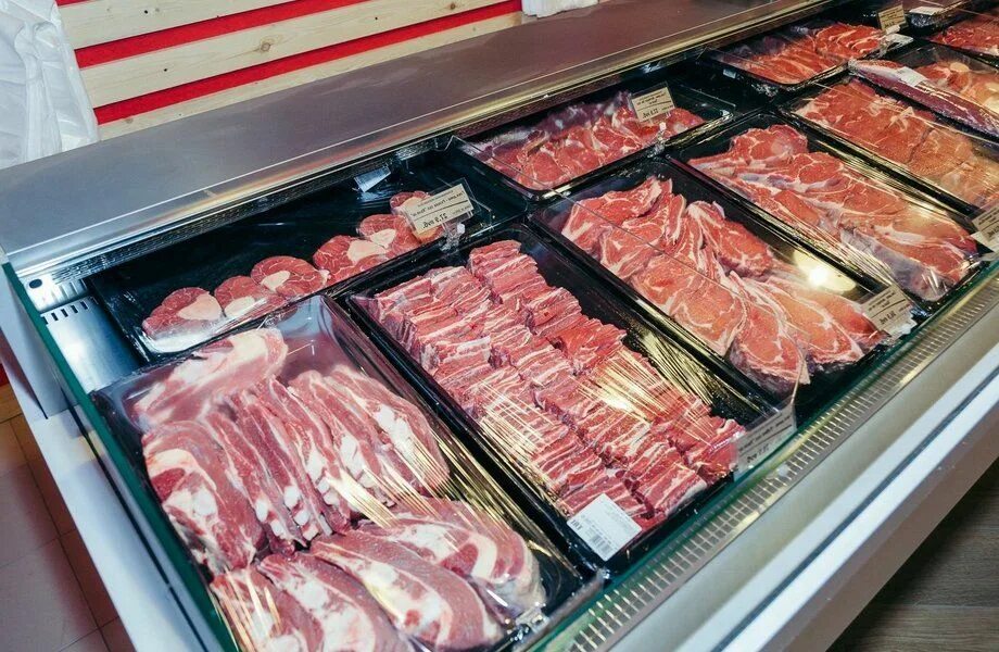 Meat Department, Showcase with Variety of Meat in Different Cuts Stock Photo - I