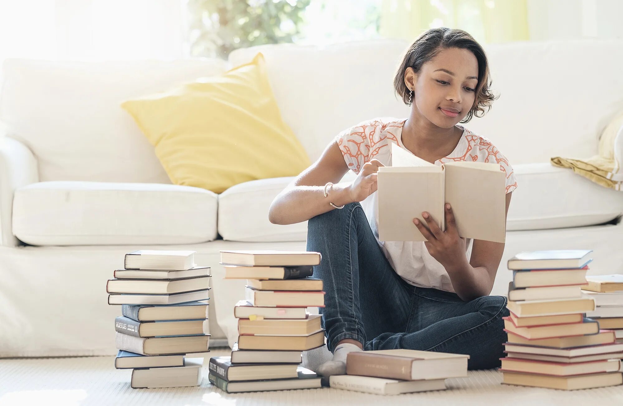 She read a book when. Person on the floor reading a book. read a book on the floor. pile books on the floor. reading takes you.