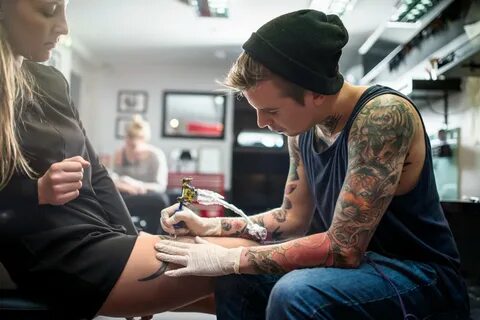 Girl getting tattoo
