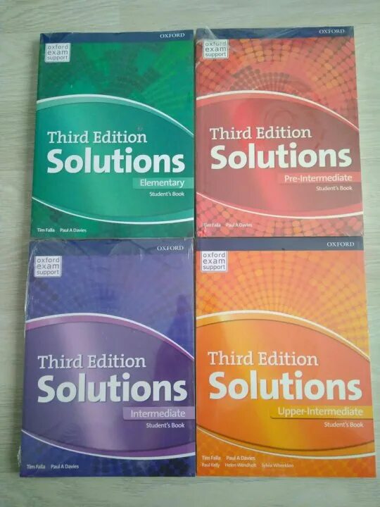 Solutions 3 edition elementary books. Учебник third Edition solutions. Солюшнс 3 эдишн. Third Edition solutions Upper Intermediate. Учебник по английскому solutions third Edition красный.