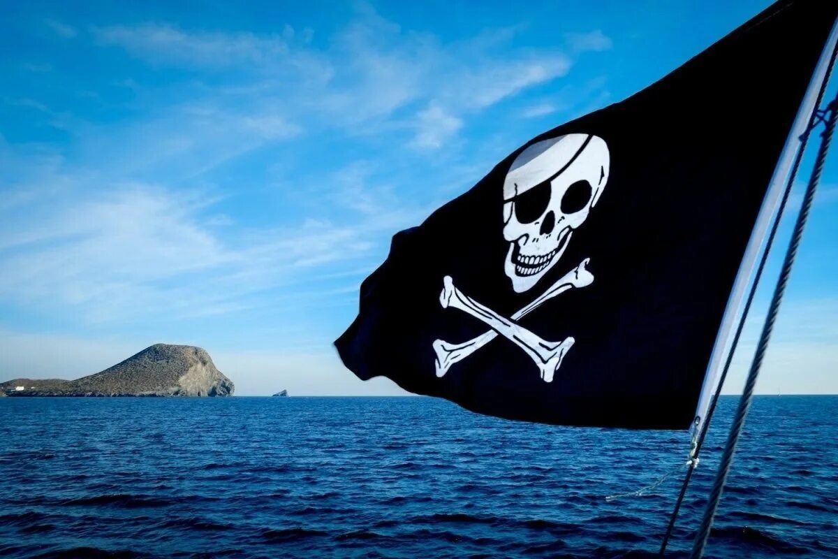 Улыбка это флаг корабля. Весёлый Роджер флаг. Веселый Роджер пираты Карибского моря. Флаг пиратов веселый Роджер. Флаг пиратов Карибского моря.