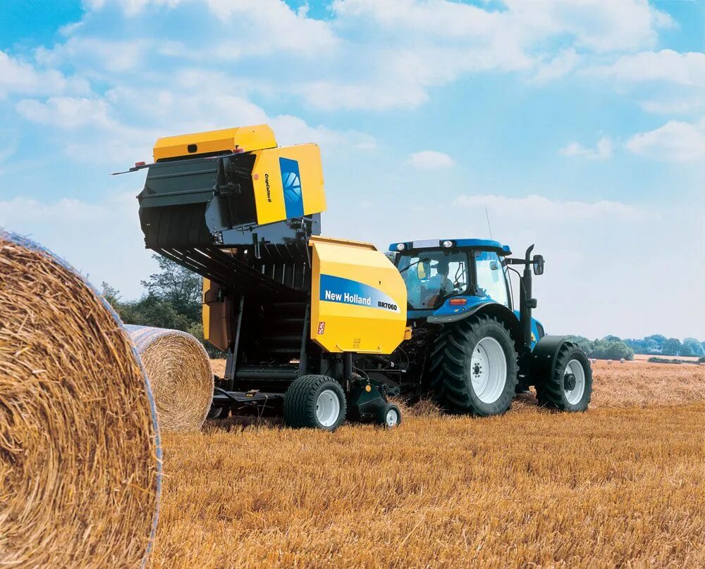 Нью Холланд агрокультура. New Holland Ford. Пресс подборщик New Holland 7070. New Holland t7000.