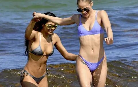 SI Swimsuit Model Danielle Herrington Oils Herself Down on a Hot
