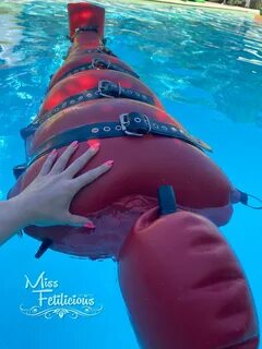 Floating in heavy rubber bondage sack : rshinybondage.