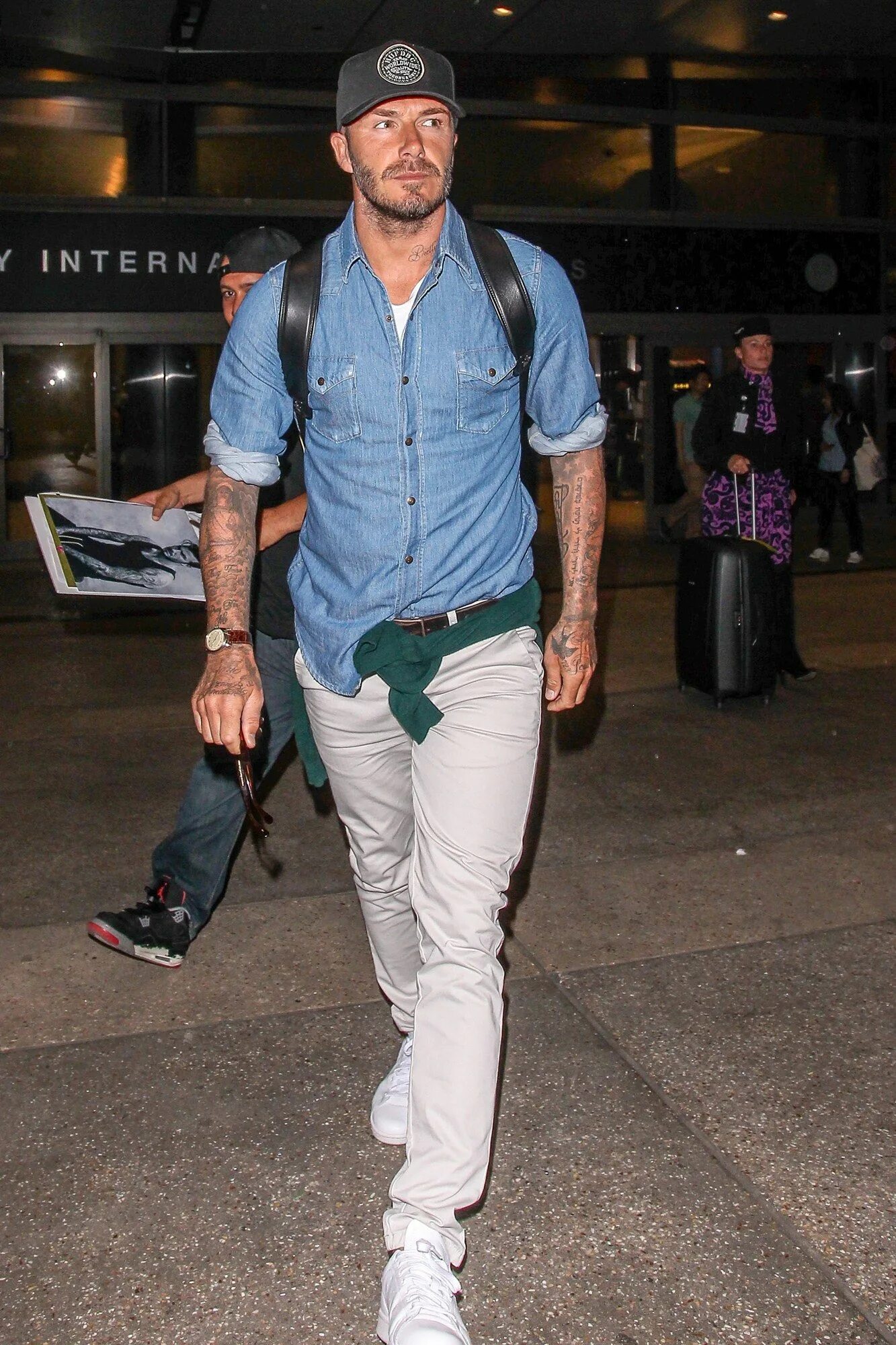 From ace airport rigs to sharp-as-hell suits, here are David Beckham's most styl