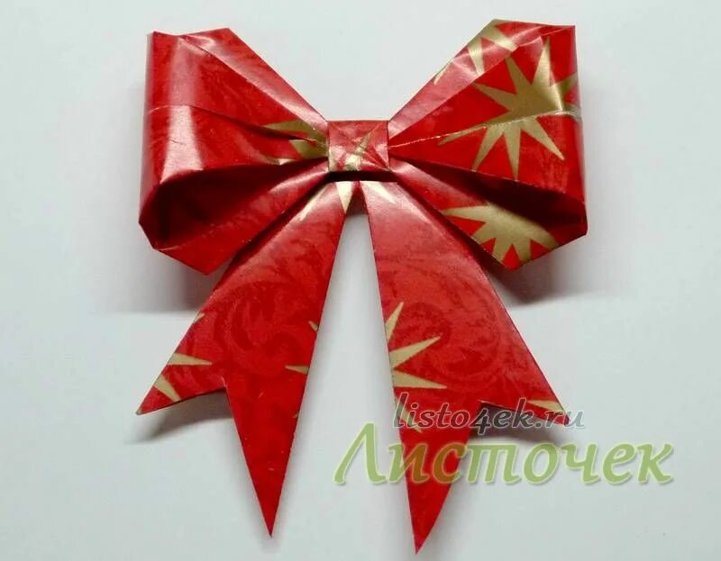 бантик из бумаги своими руками. бантик из бумаги. как сделать бантики на елку из бумаги. бантик из бумаги. новогодний бант из бумаги.
