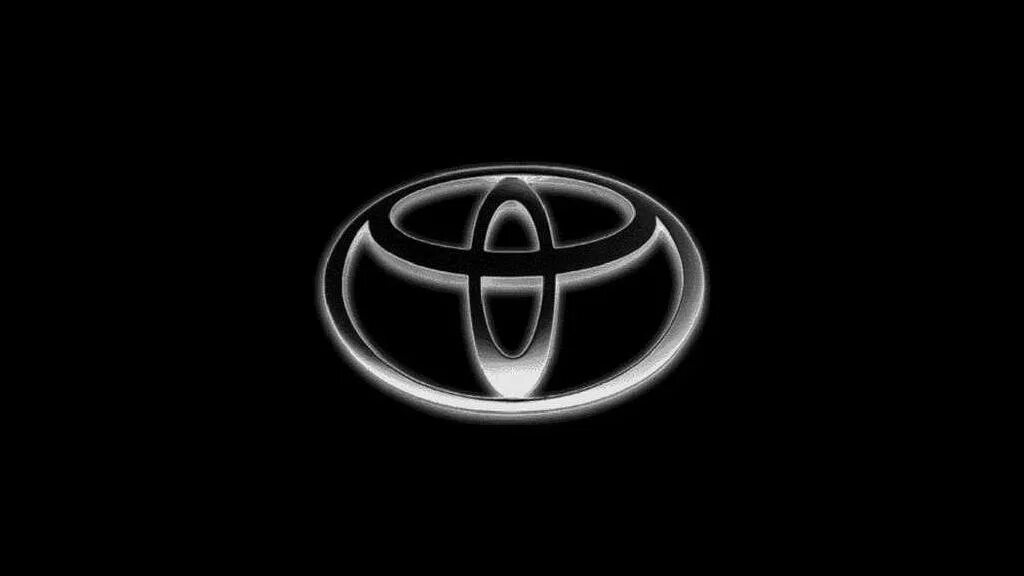 Toyota logotype. Значок Тойота на черном фоне. Эмблемы авто на черном фоне. Логотип Тойота черный.