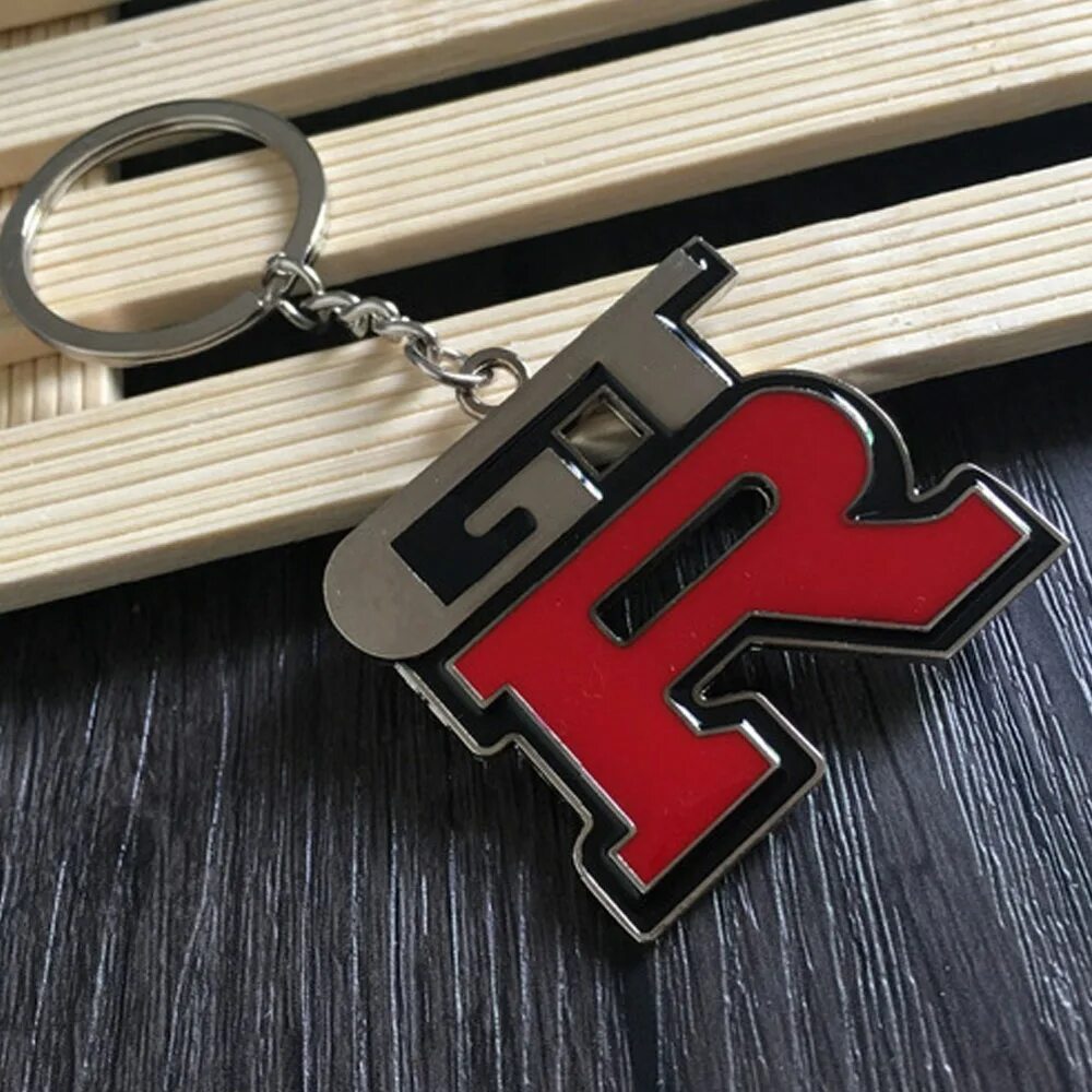 Брелок skyline r34. Брелок mashinokom. Брелок skyline. Брелок skyline r34. Брелок скайлайн.