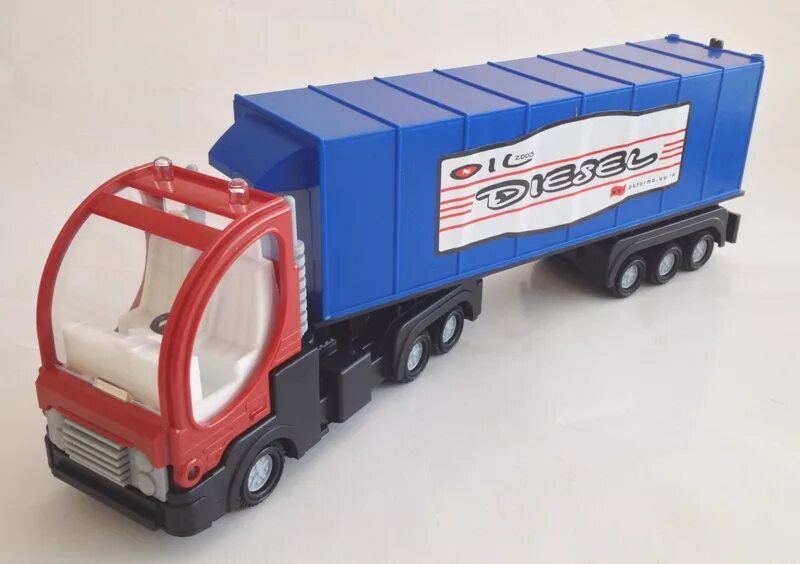 Машины фуры игрушки. Dickie toys грузовик. Игрушечные грузовые машины. Грузовик cararama construction lorry самосвал с прицепом (47606) 1:60. Грузовик с прицепом игрушка.