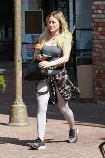 Hilary Duff looks great in Nike leggings and a grey tank top as she leaves ...