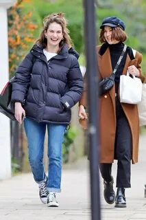 lily james is all smiles while out for stroll with a friend in north london...