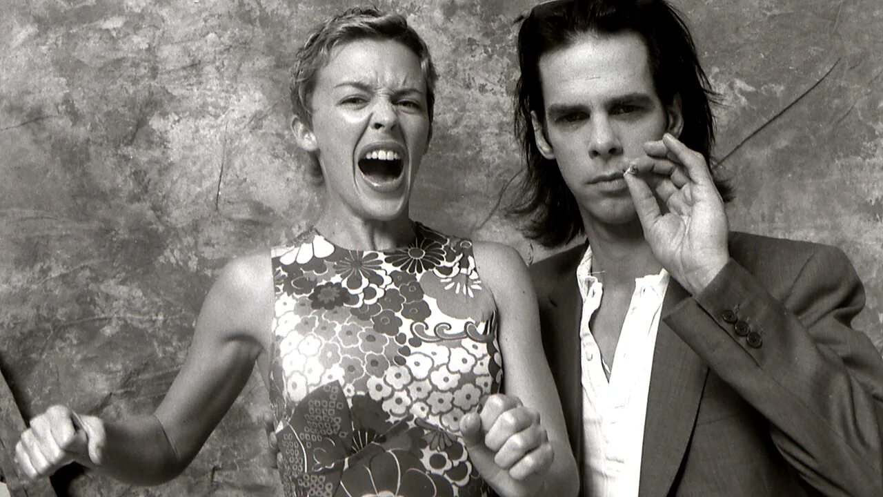 Nick cave wild rose. Ник Кейв и Кайли Миноуг. Nick Cave и Кайли Миноуг. Кэйв и ник Кейв Кайли Миноуг. Kylie Minogue и ник Кейв.