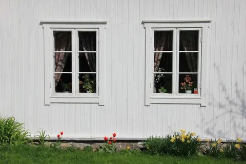 Old windows on the farmhouse at Grue, Hurdal, Norway.JPG. 