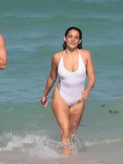 Natalie Martinez shows off her hot body in wet white see-through swimsuit a...