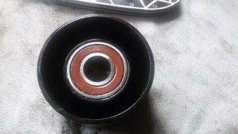 Какой подшипник стоит ролик натяжителя
