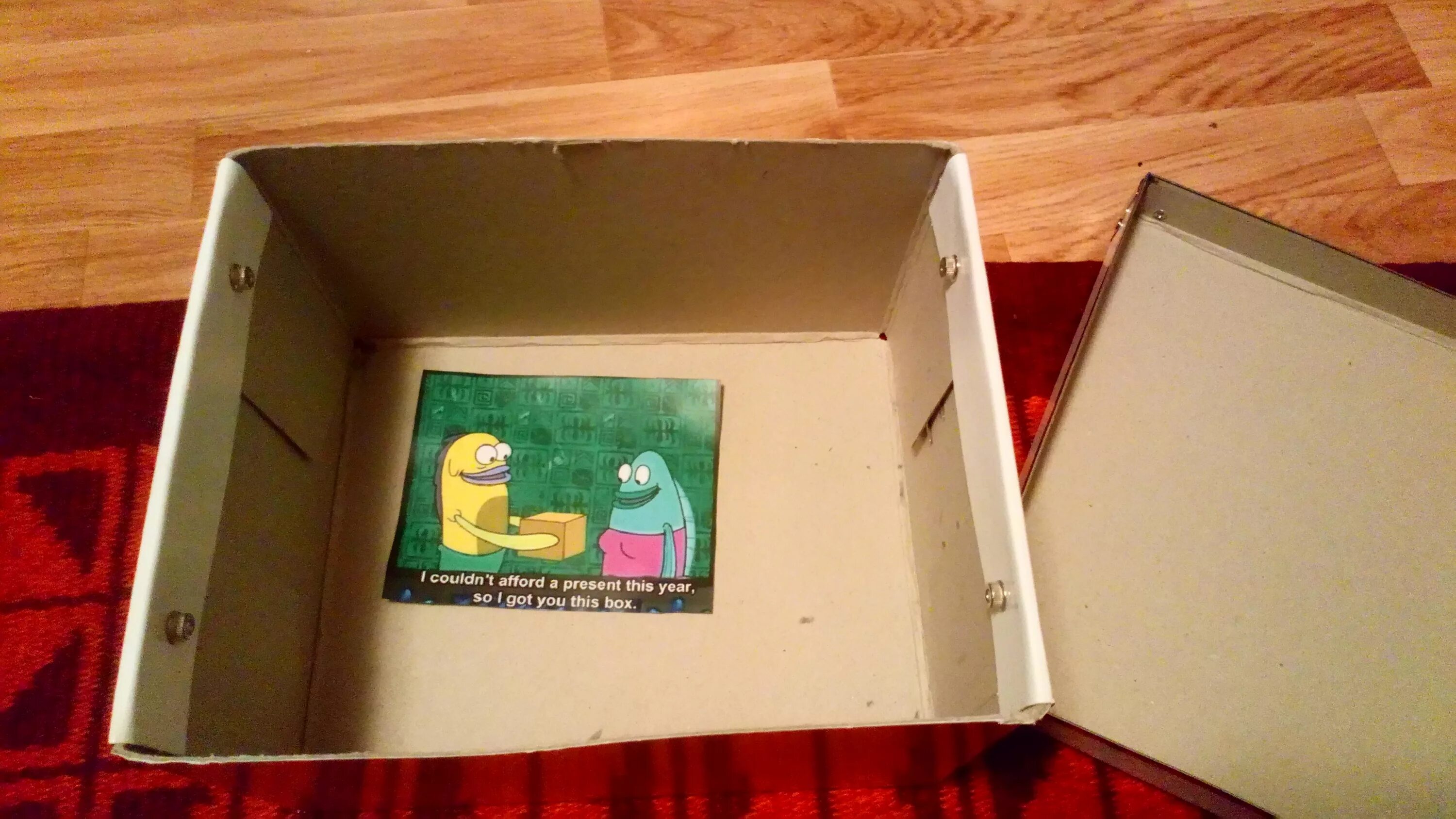 He couldn t see because. I couldn't afford a present this year so i got you this Box. Afford a Box. The year we couldn't afford. TV af Ford a Box.