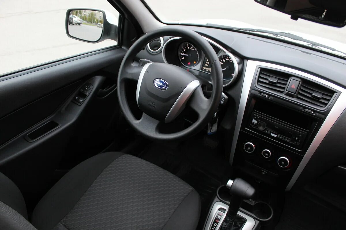 Седан datsun on-do. Датсун миду. Datsun on-do комплектация trust 3. Датсун описание. Datsun on-do 2014.