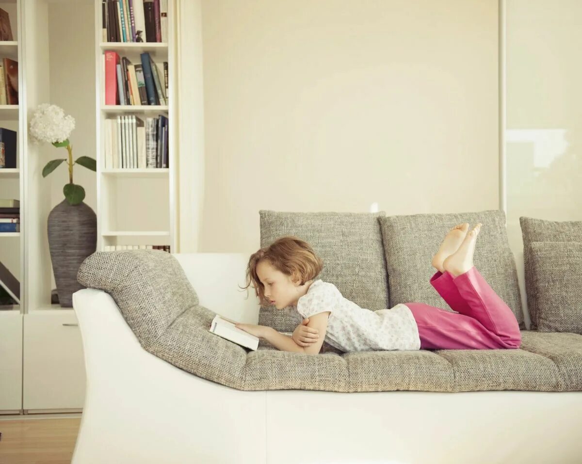 There is sofa in my room. Children in the living room. sofa in the living room kids. kids rest on the sofa. sofa_lying.