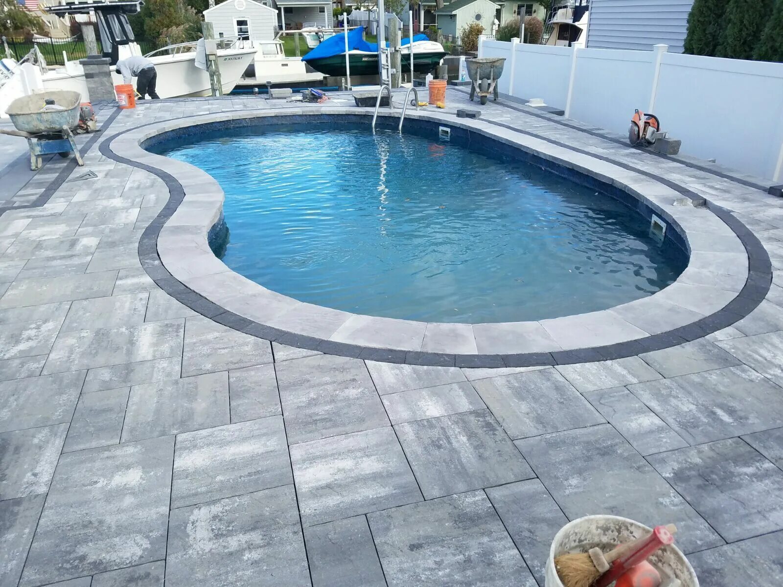 Тропический бассейн. Патио с качелями. Pool Decks installation and Repairs Concrete. Pool Patio. Pool addresses