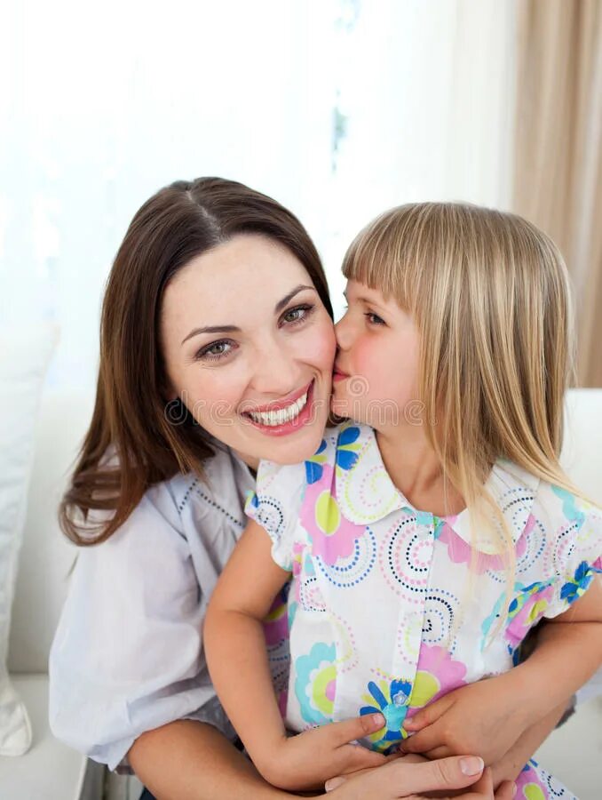 Her mother is. Мама целует дочку. Мама целует дочку в щечку. Мама целует дочь в лоб. Девочка целует маму.