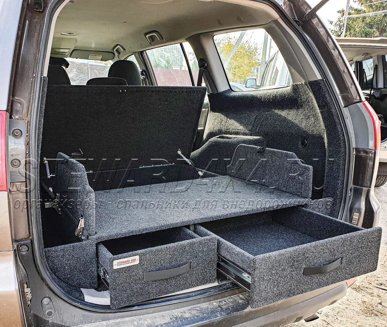 Багажник на mitsubishi pajero sport 2. Органайзер паджеро 2. Л200 мицубиси органайзер в багажник. Органайзер для mitsubishi pajero sport 2. Спальник в митсубиси паджеро 4.