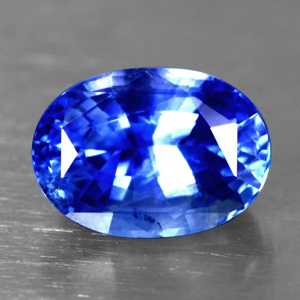 Sapphire сапфир. Синий сапфир камень. Сапфир САМОЦВЕТ. Сапфир камень неограненный. Голубой сапфир камень.