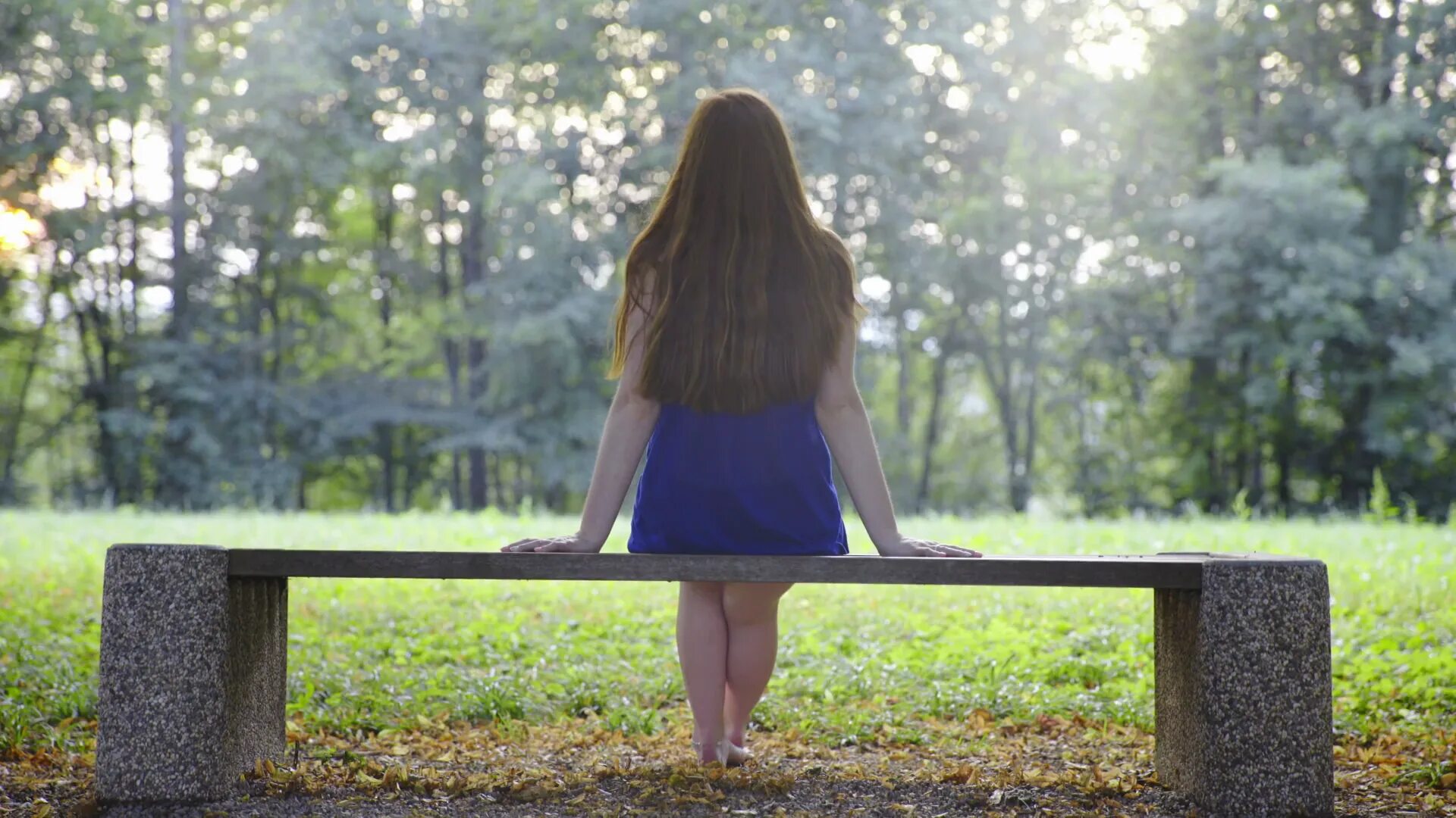 Sit on the Bench. Bench behind. Woman sitting on Bench. Sit on a bench