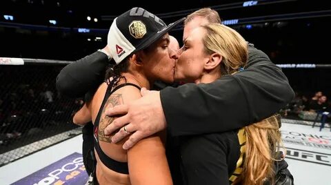 Out UFC champ Amanda Nunes shares victory kiss with partner after defending...