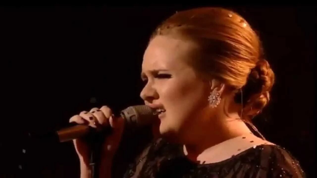 Adele singing. Somebody singing