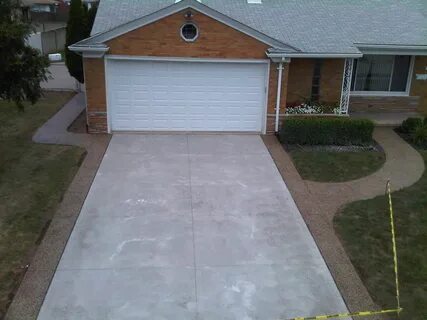 Concrete driveway with Exposed Aggregate borders 248-629-9260.